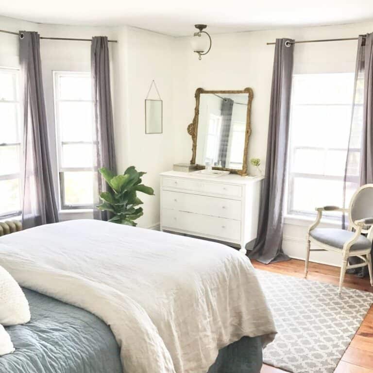 Bedroom With Gray and White Oval Back Chair