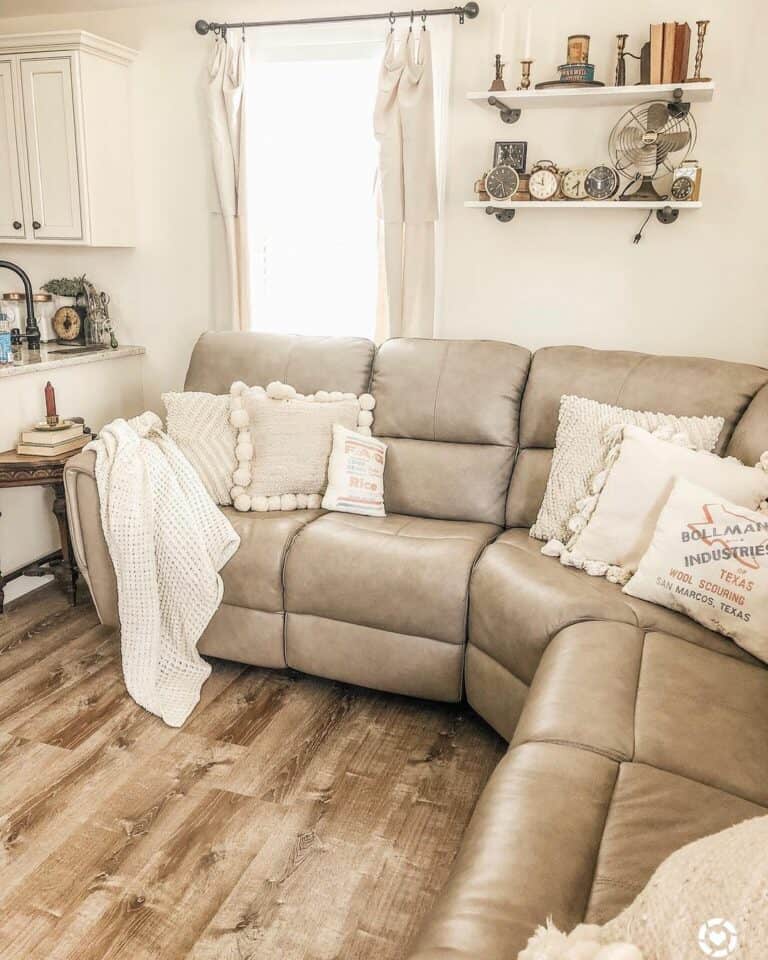 Beige Sectional Rests on Wood Flooring