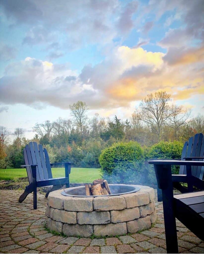 Black Adirondack Chair WIth Brick Firepit