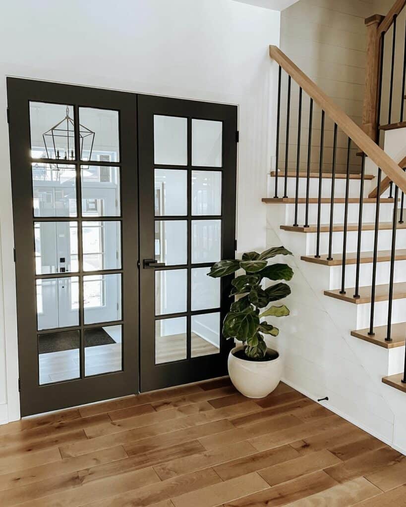 Black French Doors and Wood Staircase - Soul & Lane