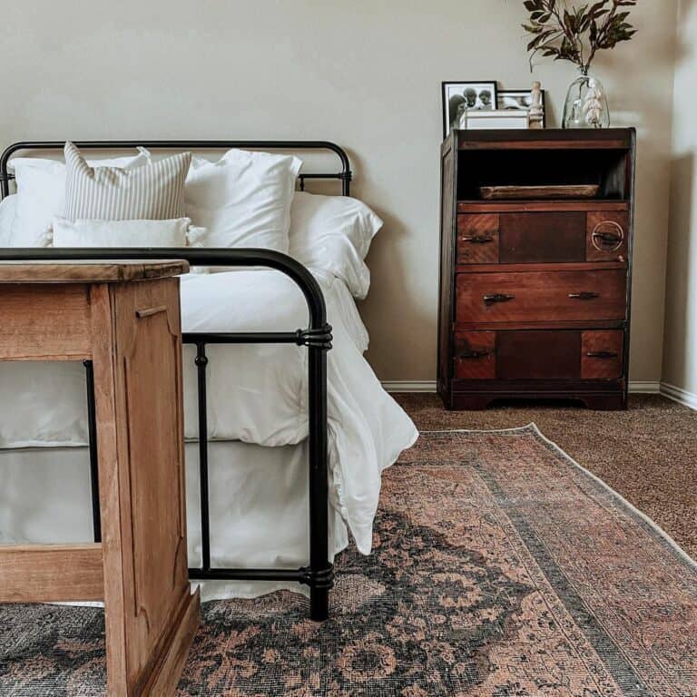 Black Metal Bed With Antique Stained Wood Dresser