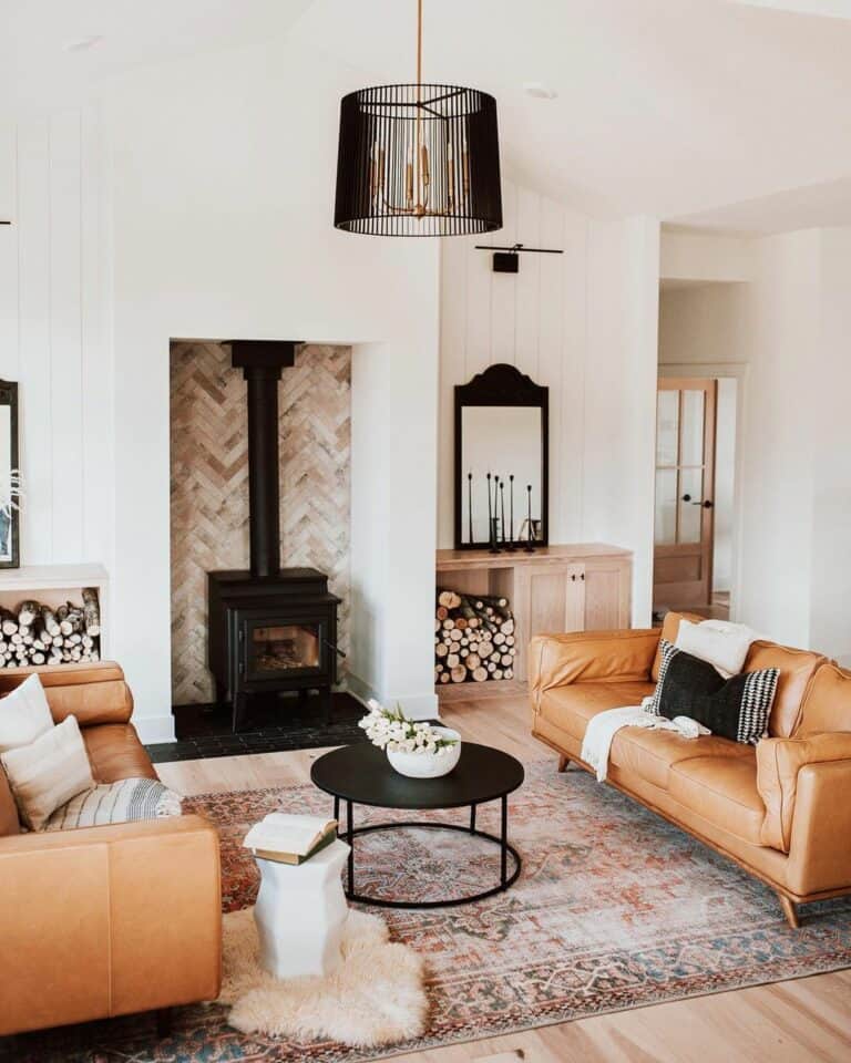 Black Metal Fireplace Against Herringbone-patterned Wall