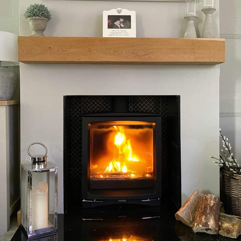 Black Metal Fireplace Amidst Gray Walls