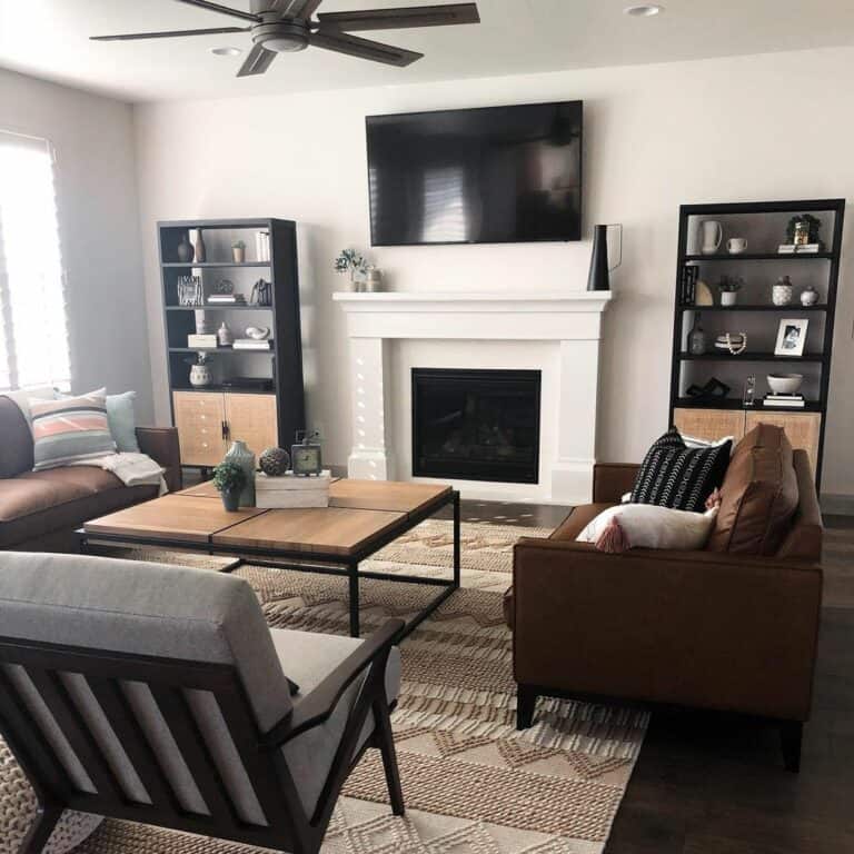 Black Shelves and Brown Leather Couches