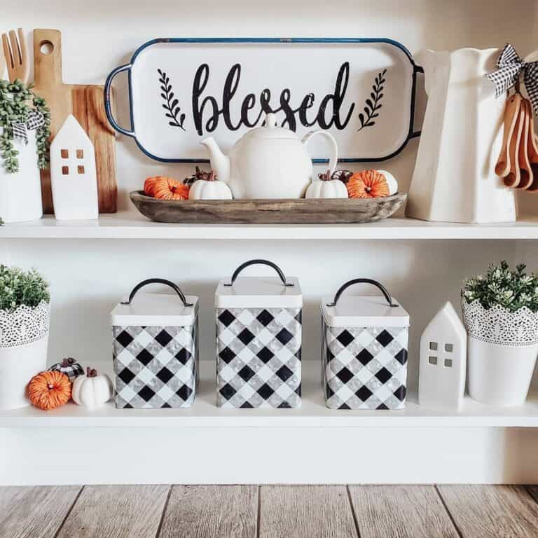 Black and White Fall Display with Orange Pumpkins
