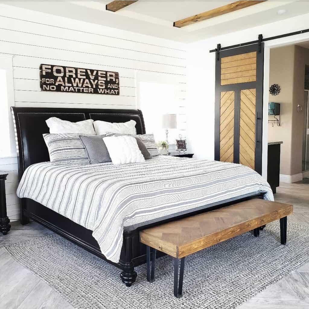 Black and White Farmhouse Bedroom With Sliding Barn Doors
