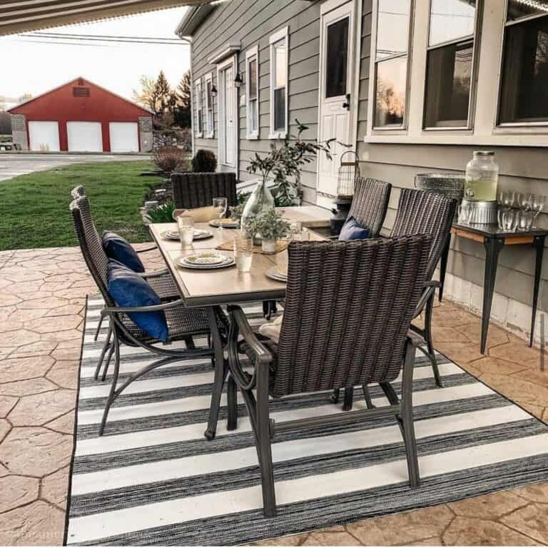 Black and White Striped Rug on Small Patio