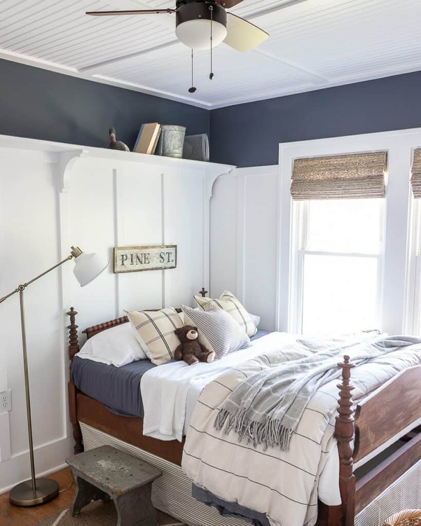 Blue and White Bedroom With Wood Bedframe