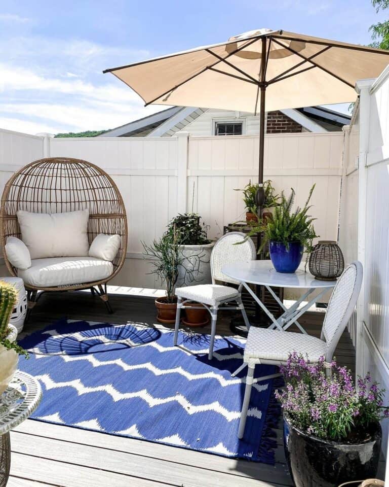 Blue and White Rug Adds Color To Small Patio