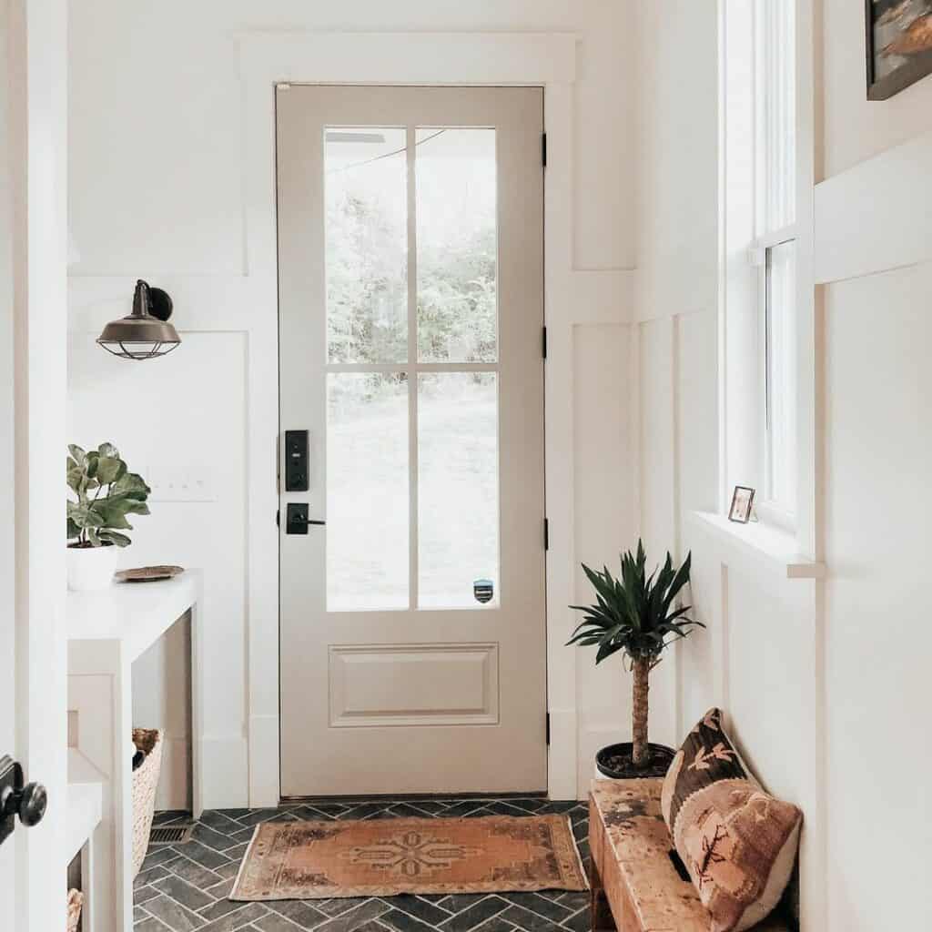 Bright Entryway with Dark Herringbone Tile