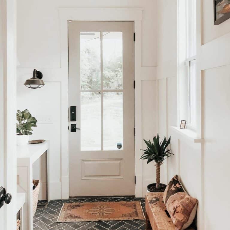 Bright Entryway with Dark Herringbone Tile