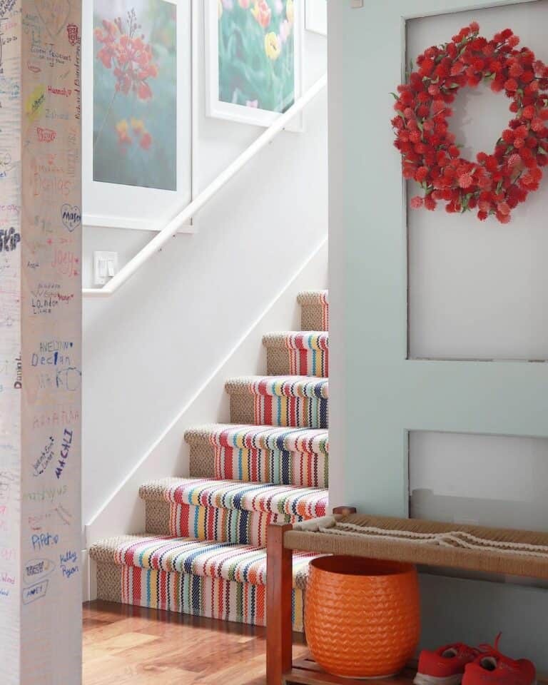 Bright Multi-colored Runner on Beige Carpeted Stairs