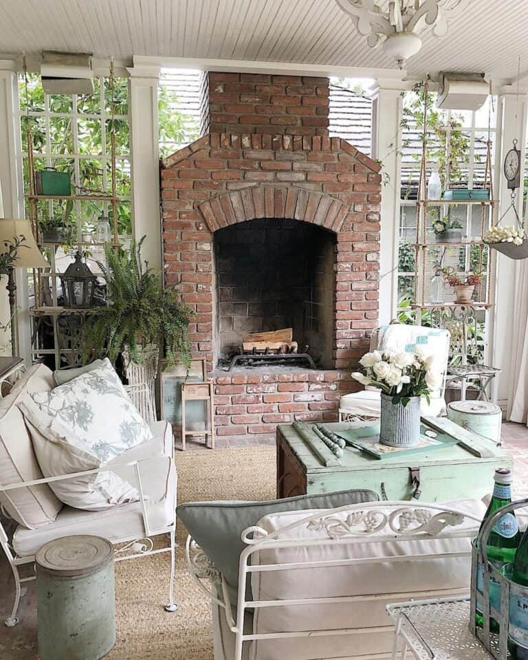 Charming Farmhouse Patio Fireplace Ideas With Potted Greenery