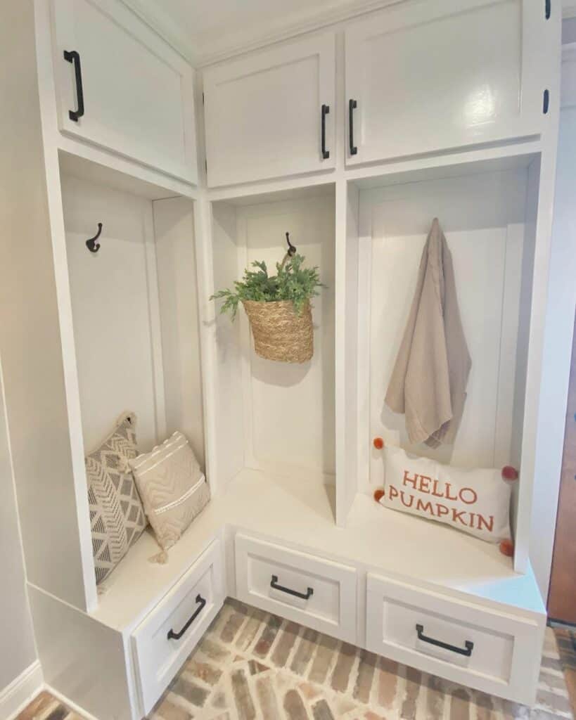 Charming White Mudroom With Natural Brick Flooring