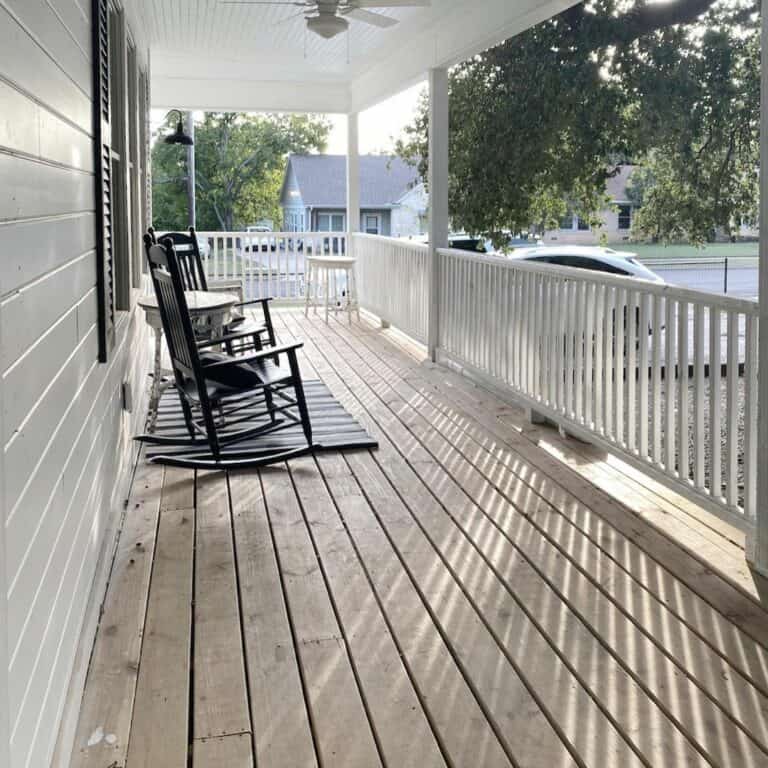 Classic Wrap-around Porch With White Posts