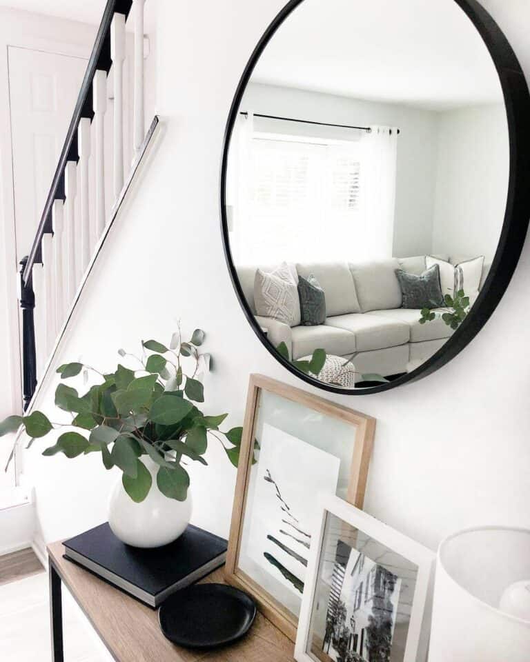 Contrasting Elements on White Staircase Wall