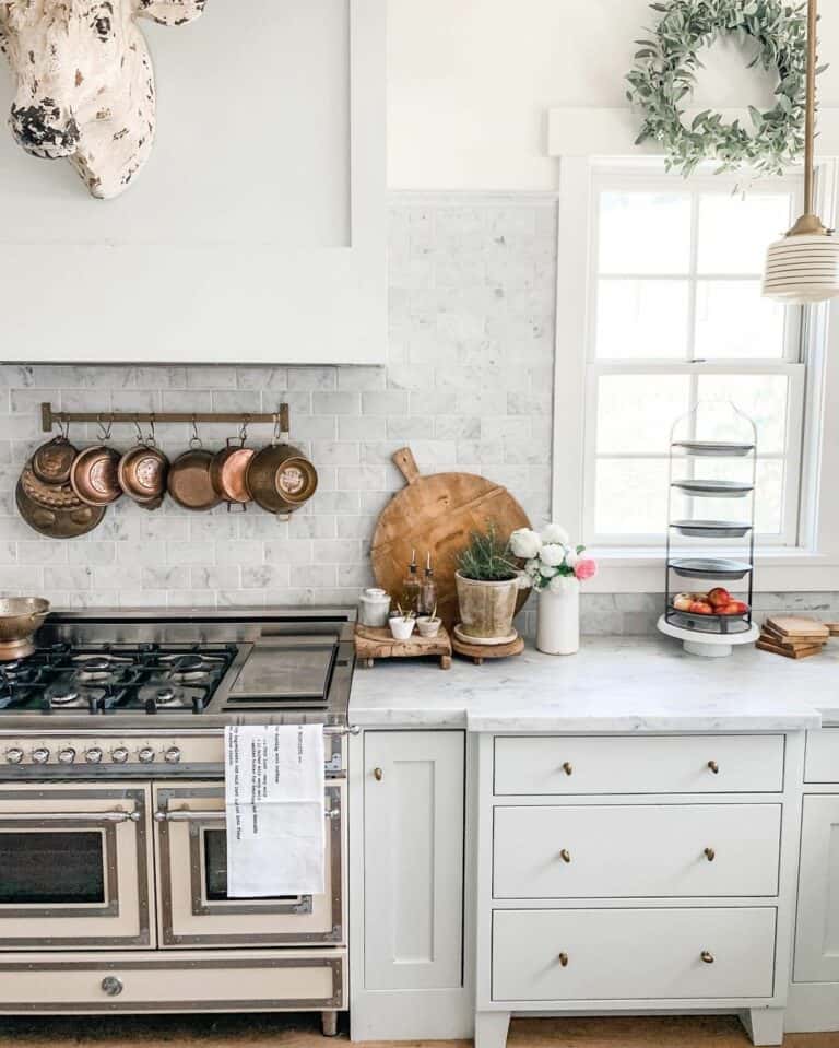 Copper Pan Organization Behind Stove