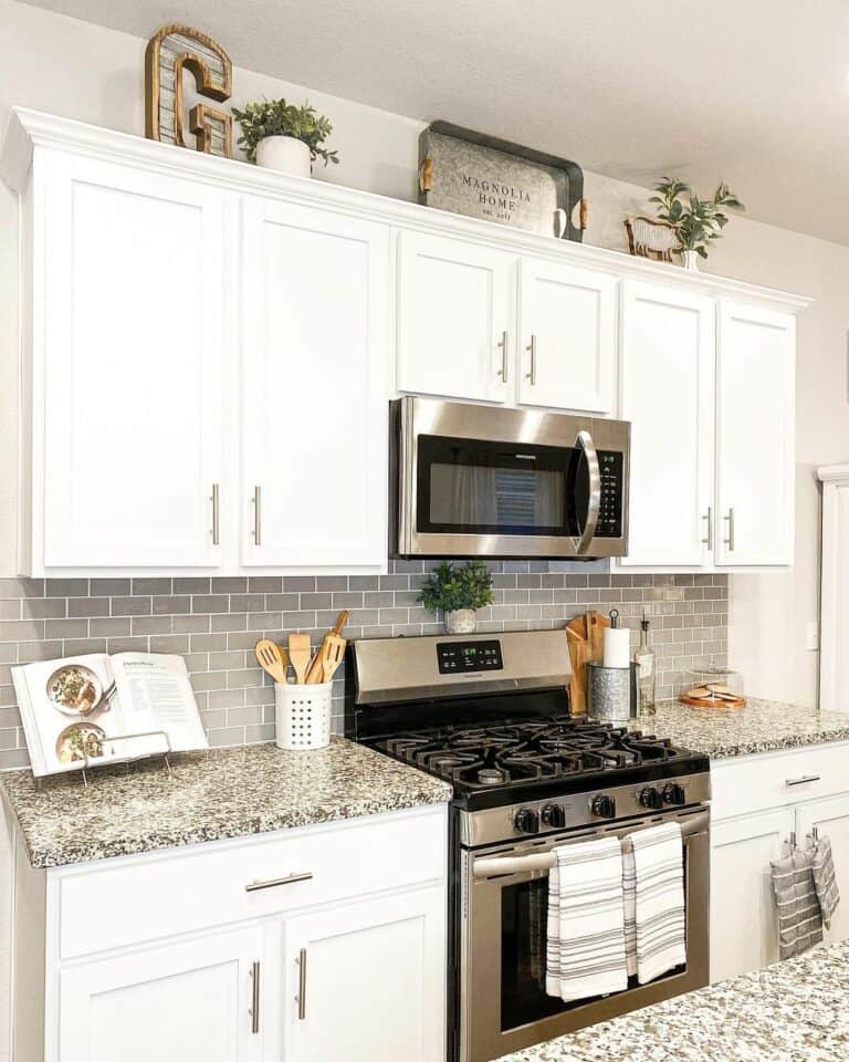 Cottage-inspired Kitchen With White Cabinets and Greenery