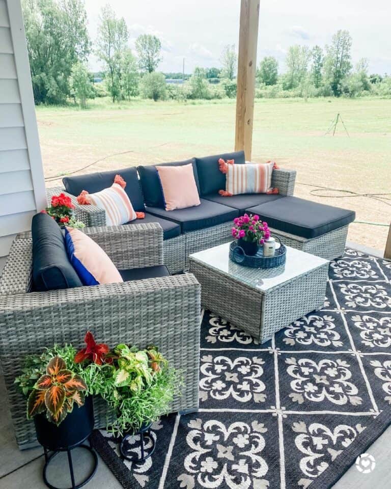 Cozy Farmhouse Porch With Brightly Colored Greenery