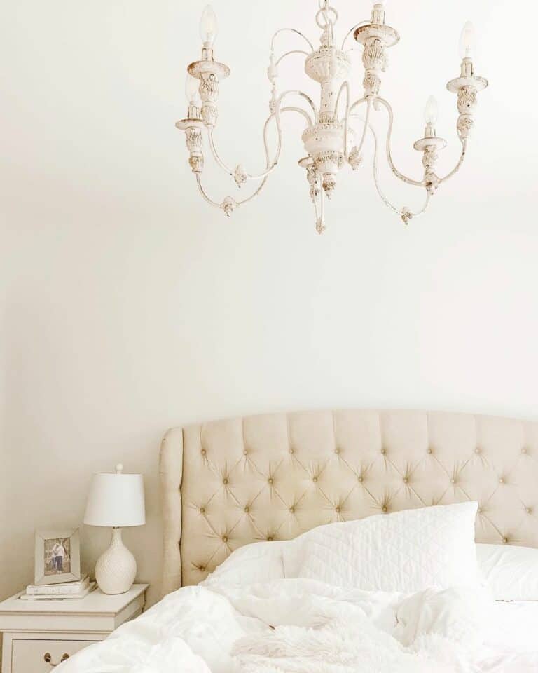 Cream Padded Headboard With Vintage Chandelier