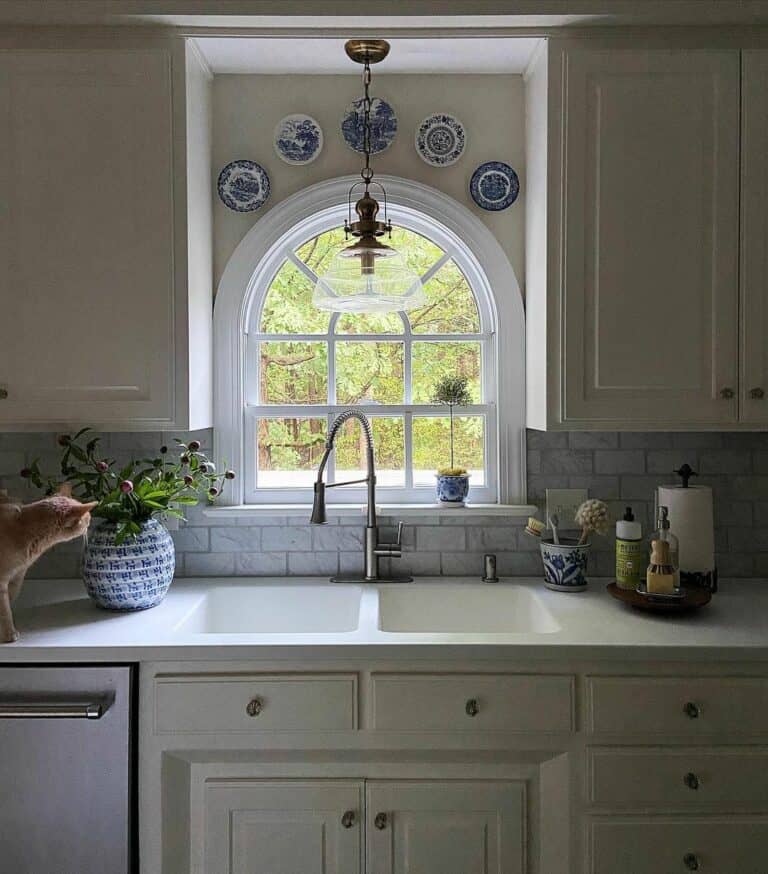 Decorative Ceramic Plates Over Arched Window