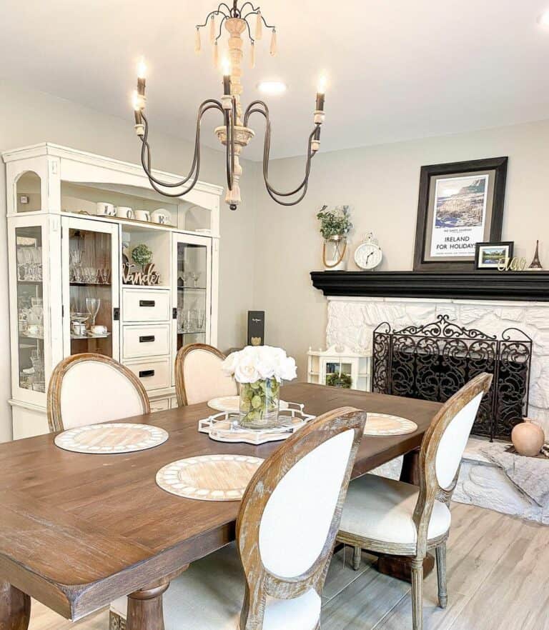 Dining Room With White Stone Fireplace