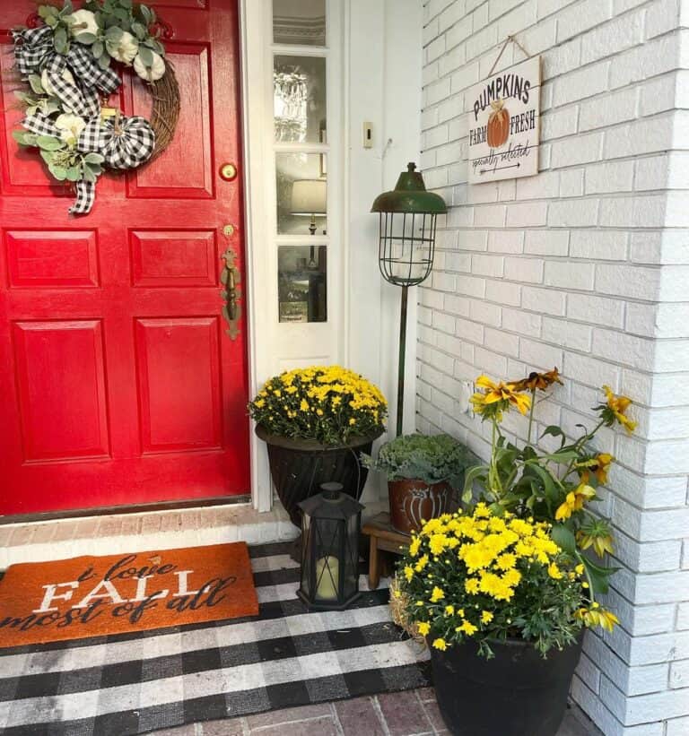 Distinctive Farmhouse Harvest Front Porch With Red Door
