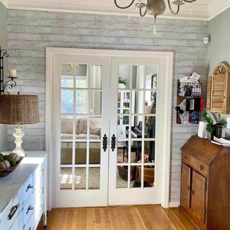 Double White Glass Doors on Gray Shiplap Wall