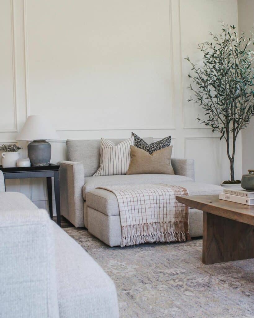 Earth-toned Living Room With White Picture Frame Molding