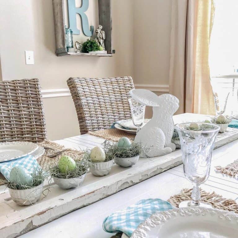 Easter Tablescape With White Rabbit and a Line of Easter Eggs