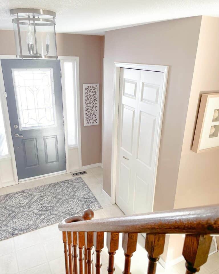 Entrance Foyer With Nickel and Glass Light Fixture
