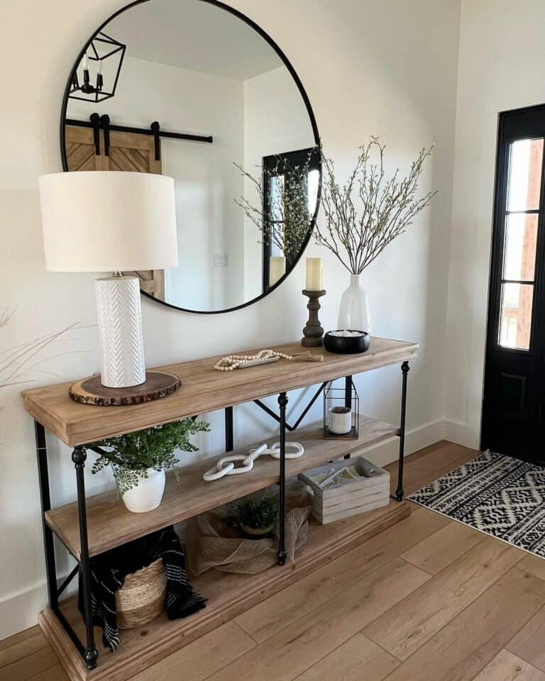 Entrance With Large Black Frame Circle Mirror