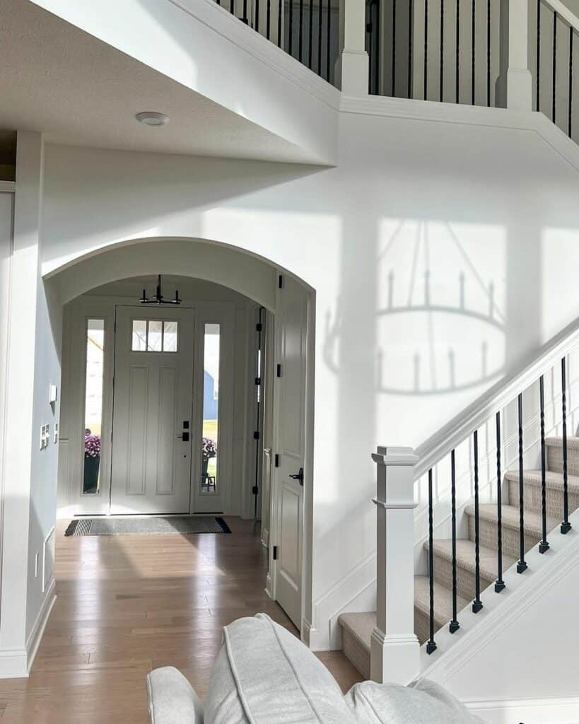 Entry Hall With White Front Door