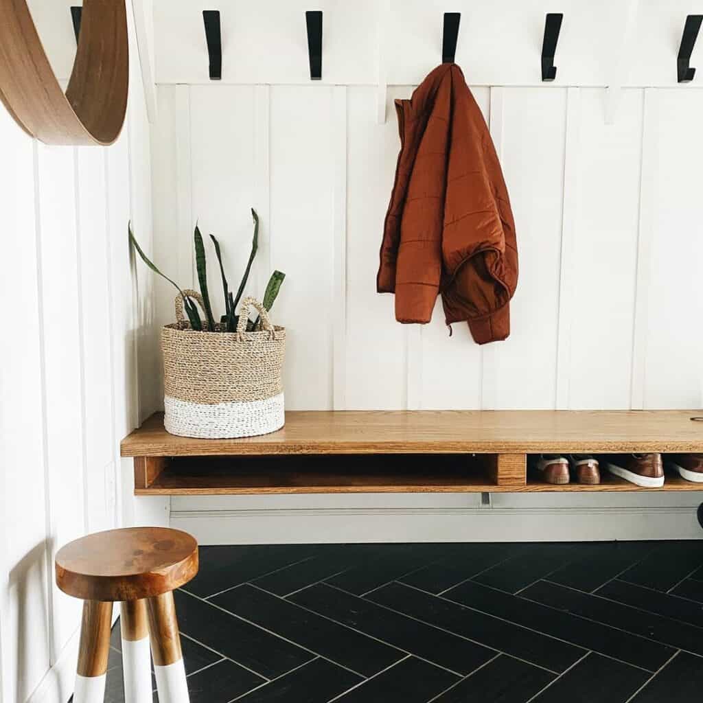 Entryway Mudroom With Black Herringbone Floor Tiles - Soul & Lane