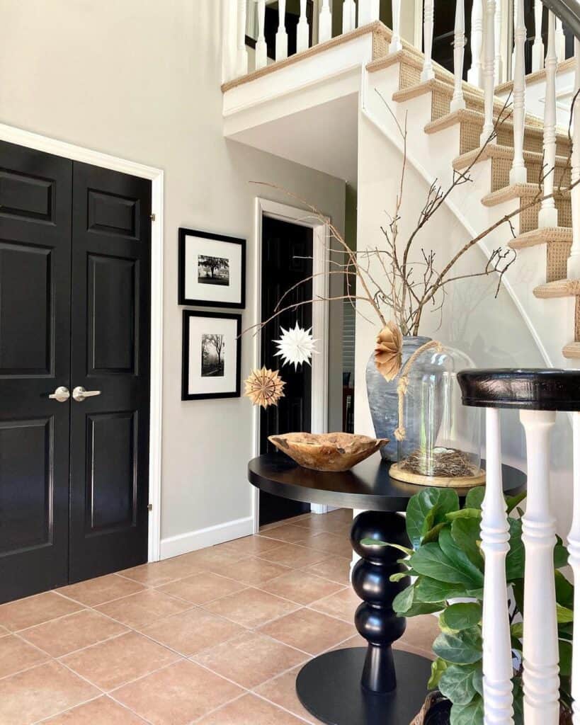 Entryway With Black Doors and White Trim