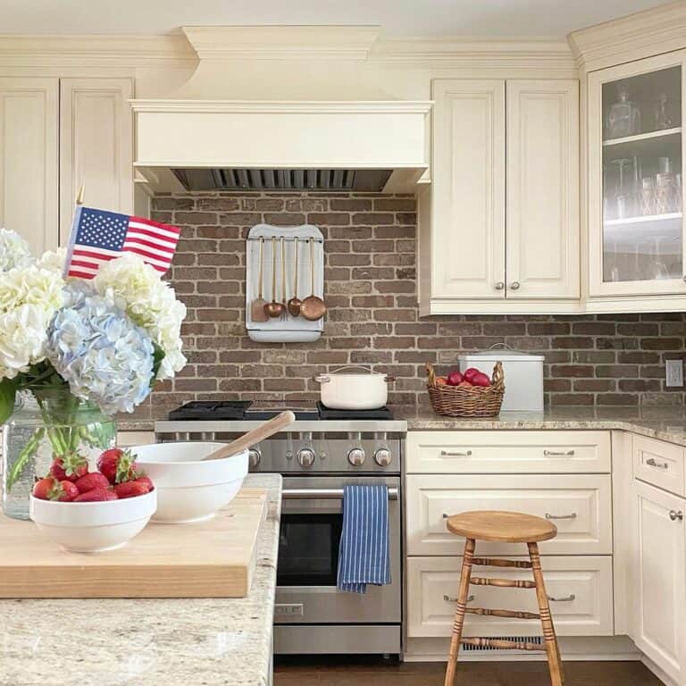 Exposed Red Brick Backsplash and Patriotic Accent Kitchen