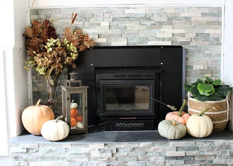 Fall-themed Metal Fireplace With Stone Backsplash