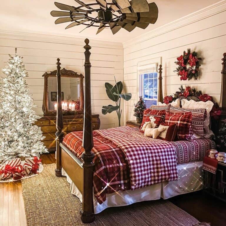 Farmhouse Bedroom With Red Plaid Blankets
