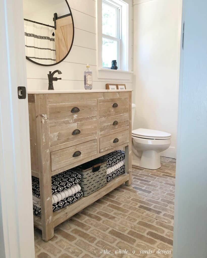 Farmhouse Brick Flooring and Distressed Vanity