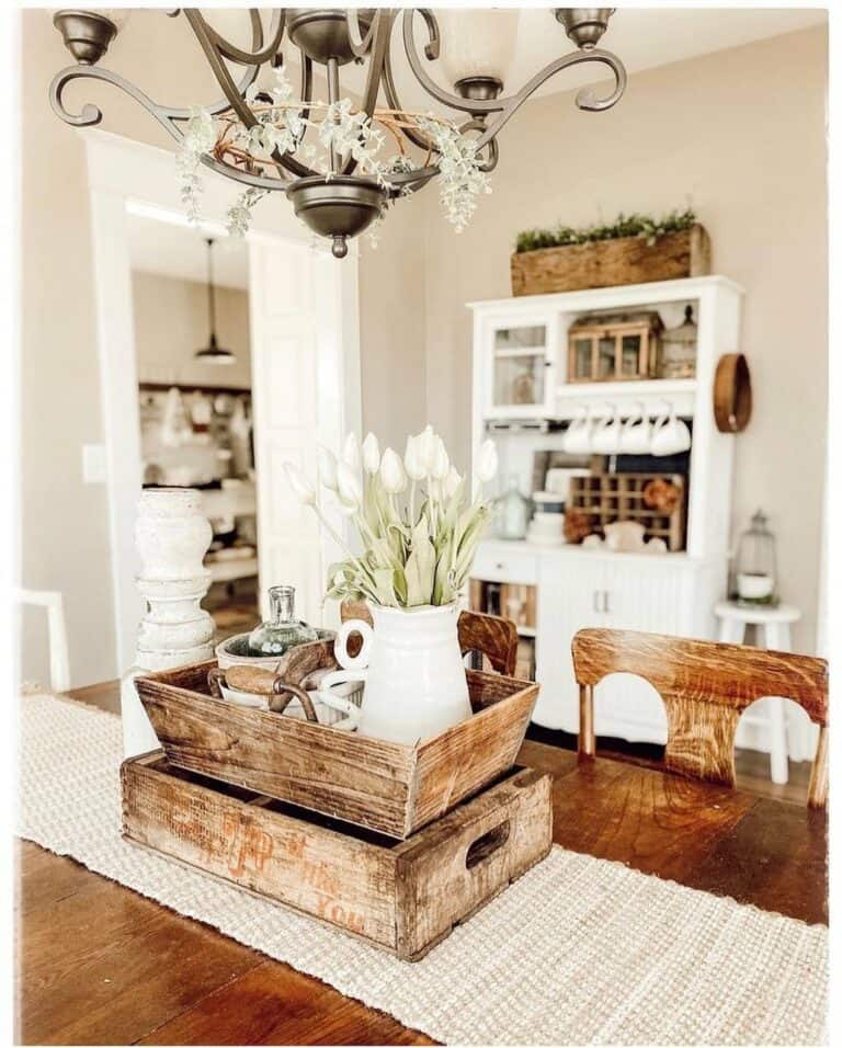 Farmhouse Dining Room With Vintage Chandelier