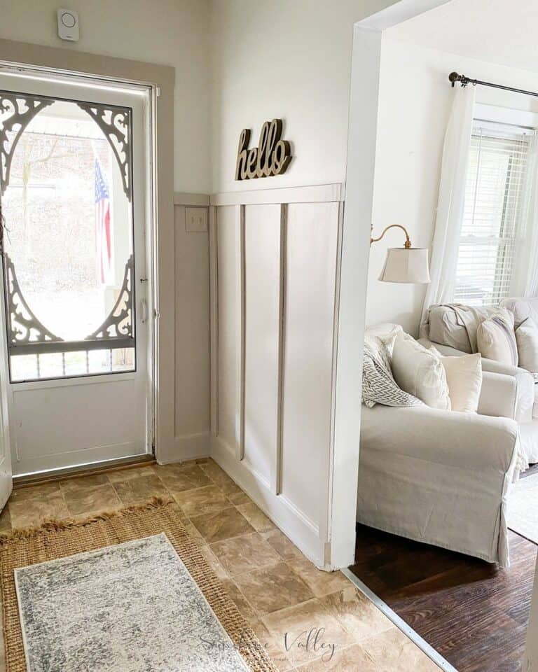 Farmhouse Entry Hallway With Layered Rugs