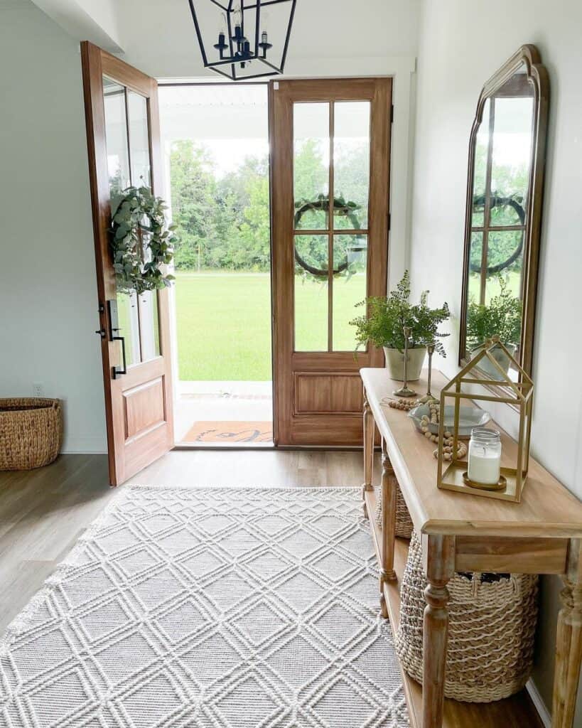 Farmhouse Entryway With Reflective Mirror