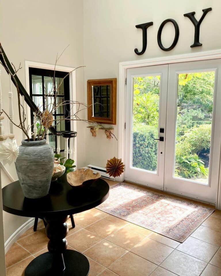 Farmhouse Foyer With Round Black Entry Table