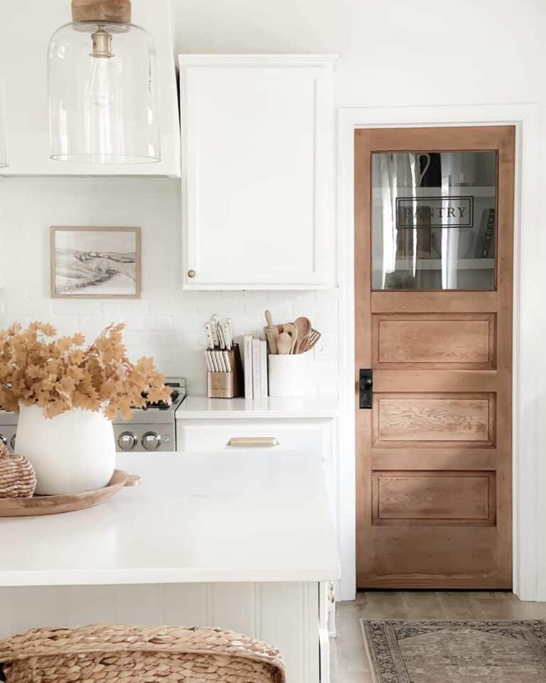 Farmhouse Kitchen With Wooden Pantry Door