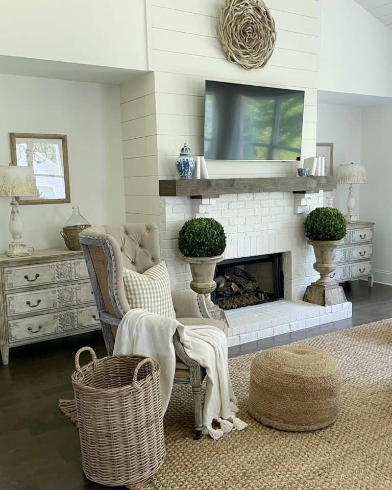 Farmhouse Living Room With Brick Fireplace