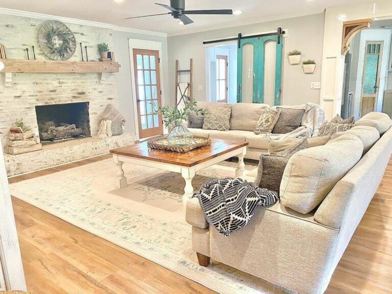 Farmhouse Living Room With Wooden French Doors