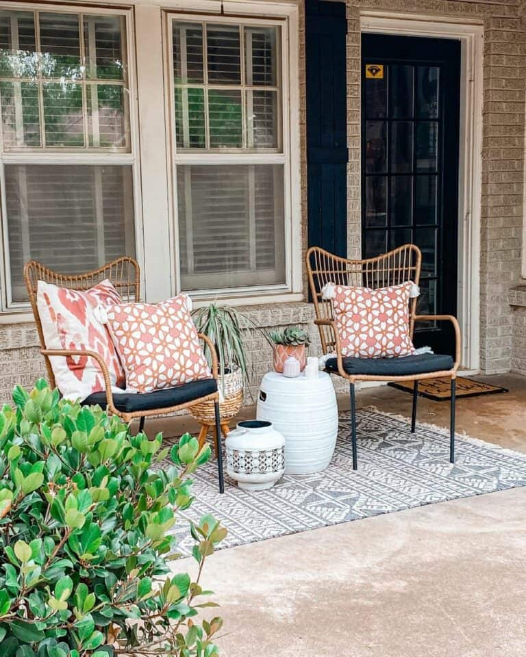 Front Porch With Pink and White Accent Cushions