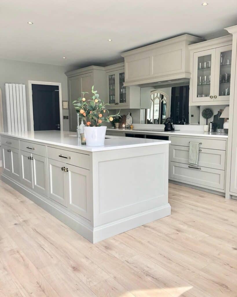 Gray Kitchen Island With Orange Plant Countertop Décor