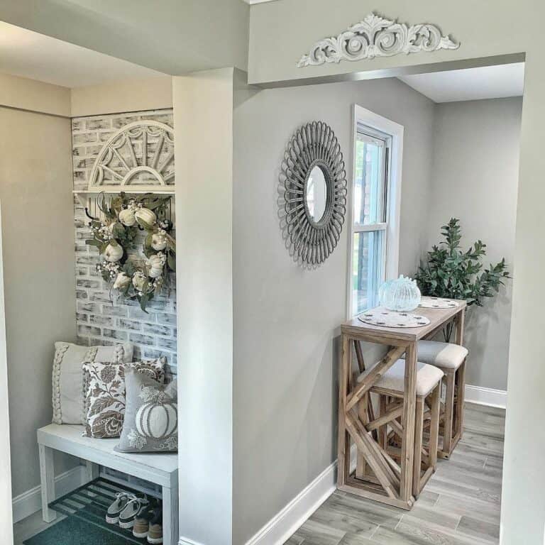 Gray Mudroom Entrance With White Boot Bench