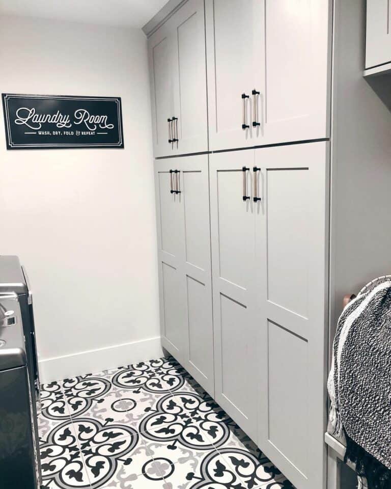 Gray Shaker Laundry Cabinets With Black Pulls